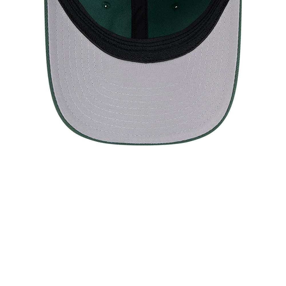 Milwaukee Bucks NBA Team Dark Green New Era 39THIRTY M-Crown Stretch Fit Cap, inside view showing the white undervisor with black stitching, a black sweatband lining the interior, and dark green taping running along the seams.