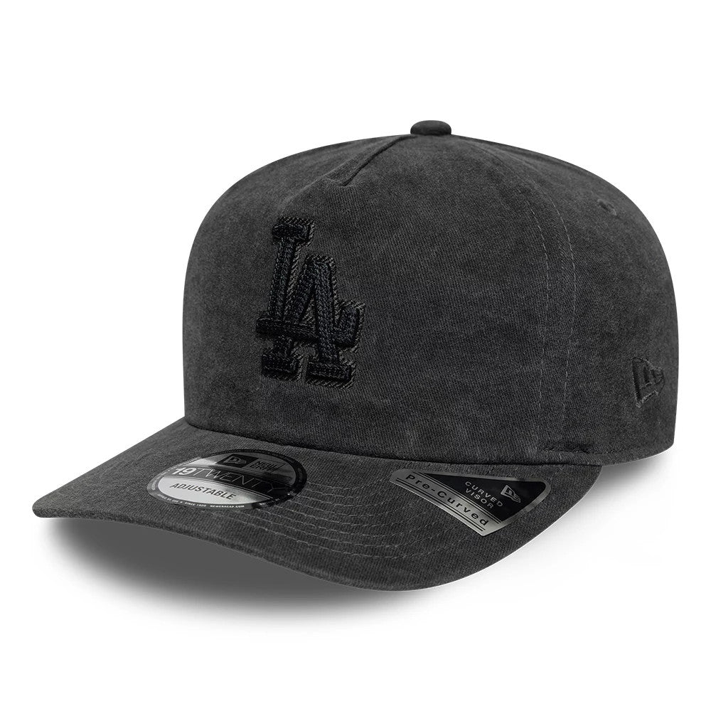 LA Dodgers MLB Black New Era 19TWENTY Adjustable Cap, three-quarter view showing a black embroidered LA logo on the front panel, a pre-curved black visor with a 19TWENTY size sticker, and the New Era flag logo on the left side.