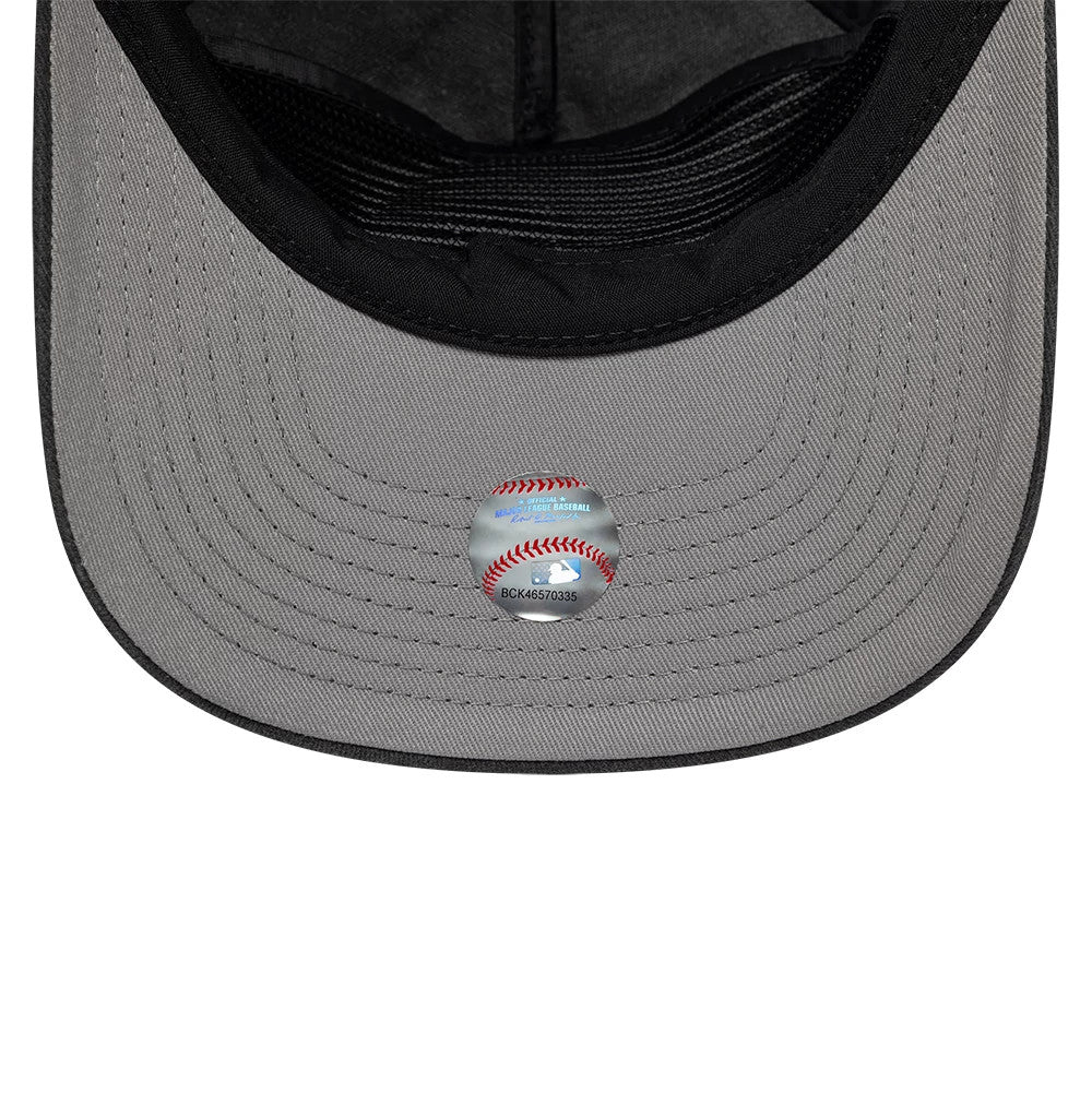 LA Dodgers MLB Black New Era 19TWENTY Adjustable Cap, inside view showing a grey undervisor with a central baseball-themed sticker, a black interior sweatband, and black taping along the seams, highlighting the cap's structure.