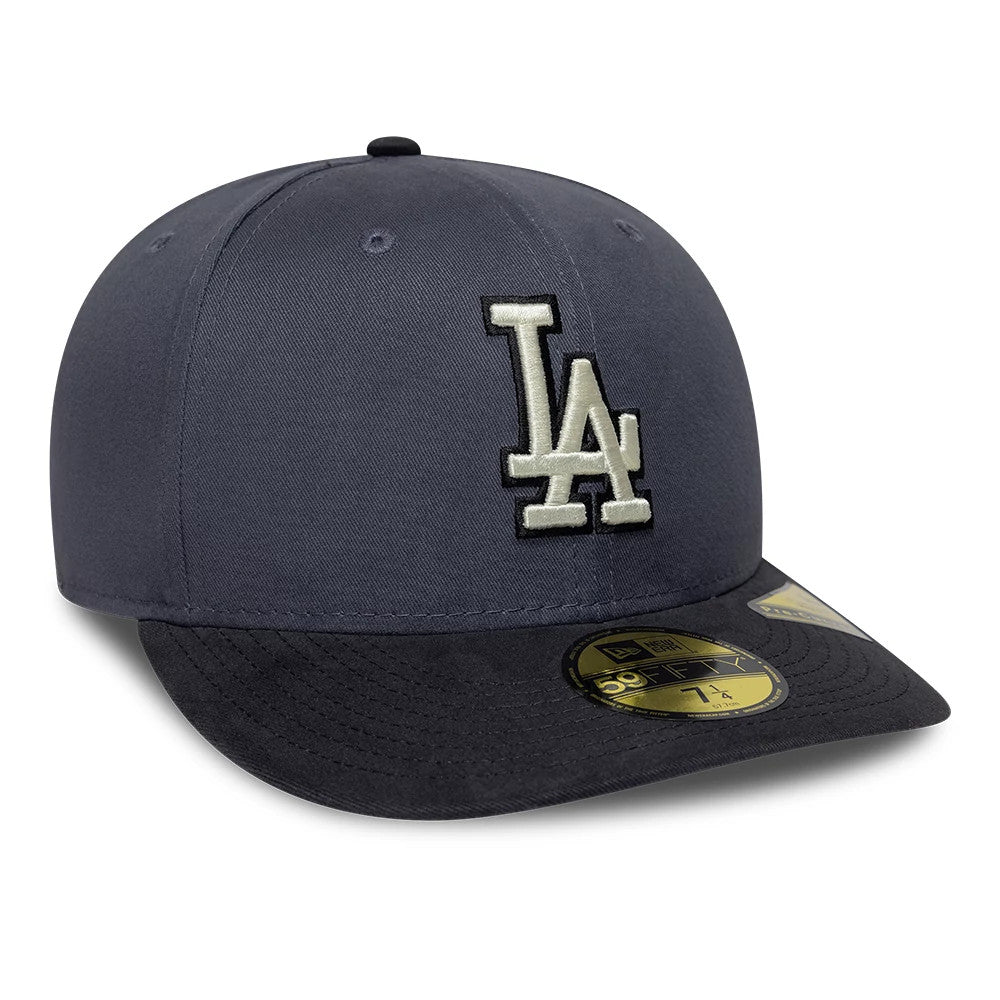 LA Dodgers MLB Dark Grey New Era 59FIFTY Fitted Cap, three-quarter view showing a large white embroidered LA logo on the structured dark grey front panels, complemented by a dark grey visor and a gold 59FIFTY size sticker on the visor.