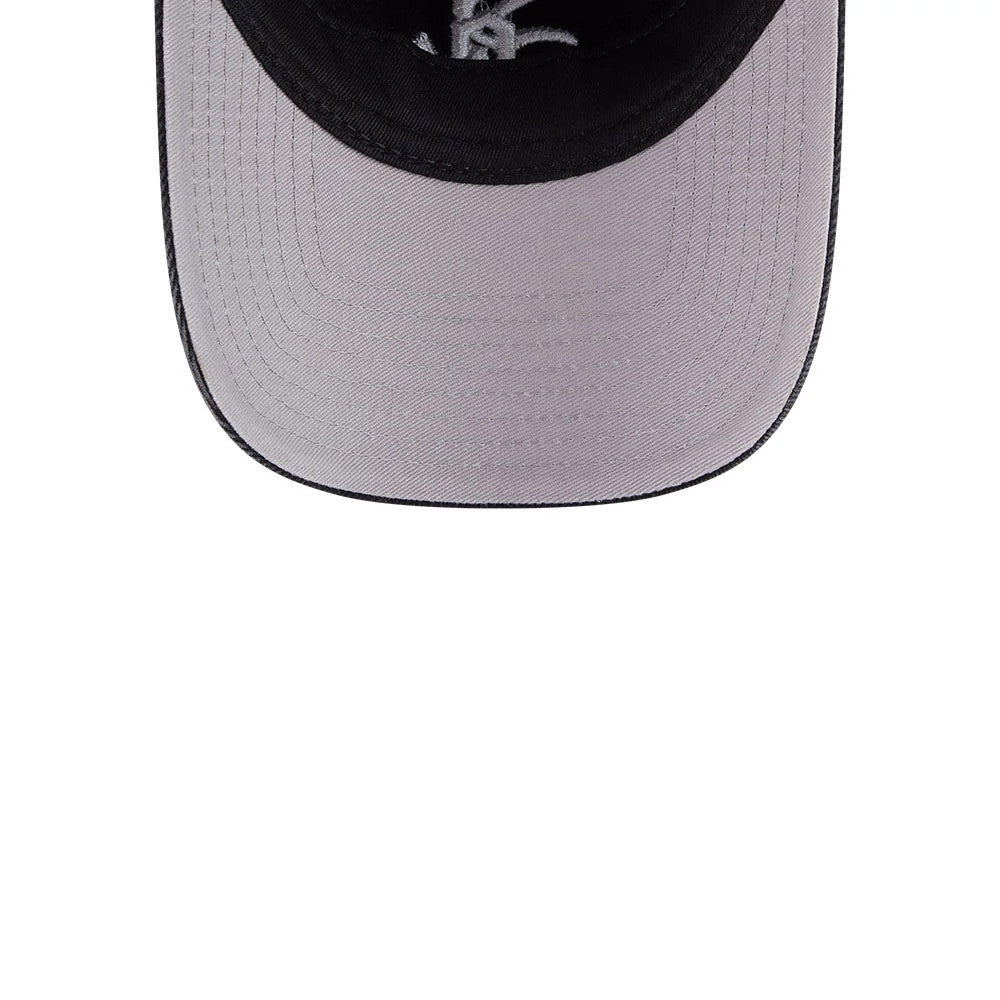 White Sox MLB Washed Denim Black New Era 9FORTY A-Frame Unstructured Adjustable Cap, top view showing the light grey underside of the pre-curved visor, the structured black crown, and the white Sox logo embroidered on the front panel.