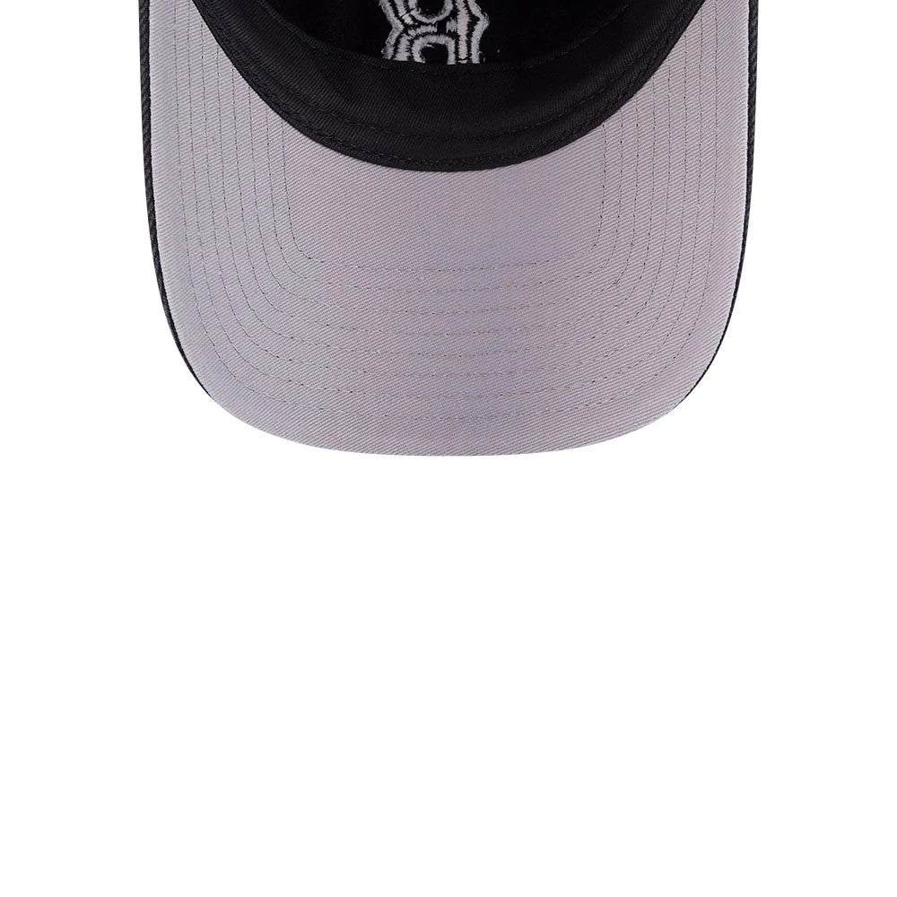 Red Sox MLB Washed Denim Black New Era 9FORTY A-Frame Unstructured Adjustable Cap, inside view showcasing a grey undervisor with detailed stitching, black fabric taping lining the interior, and the New Era logo printed on black taping.