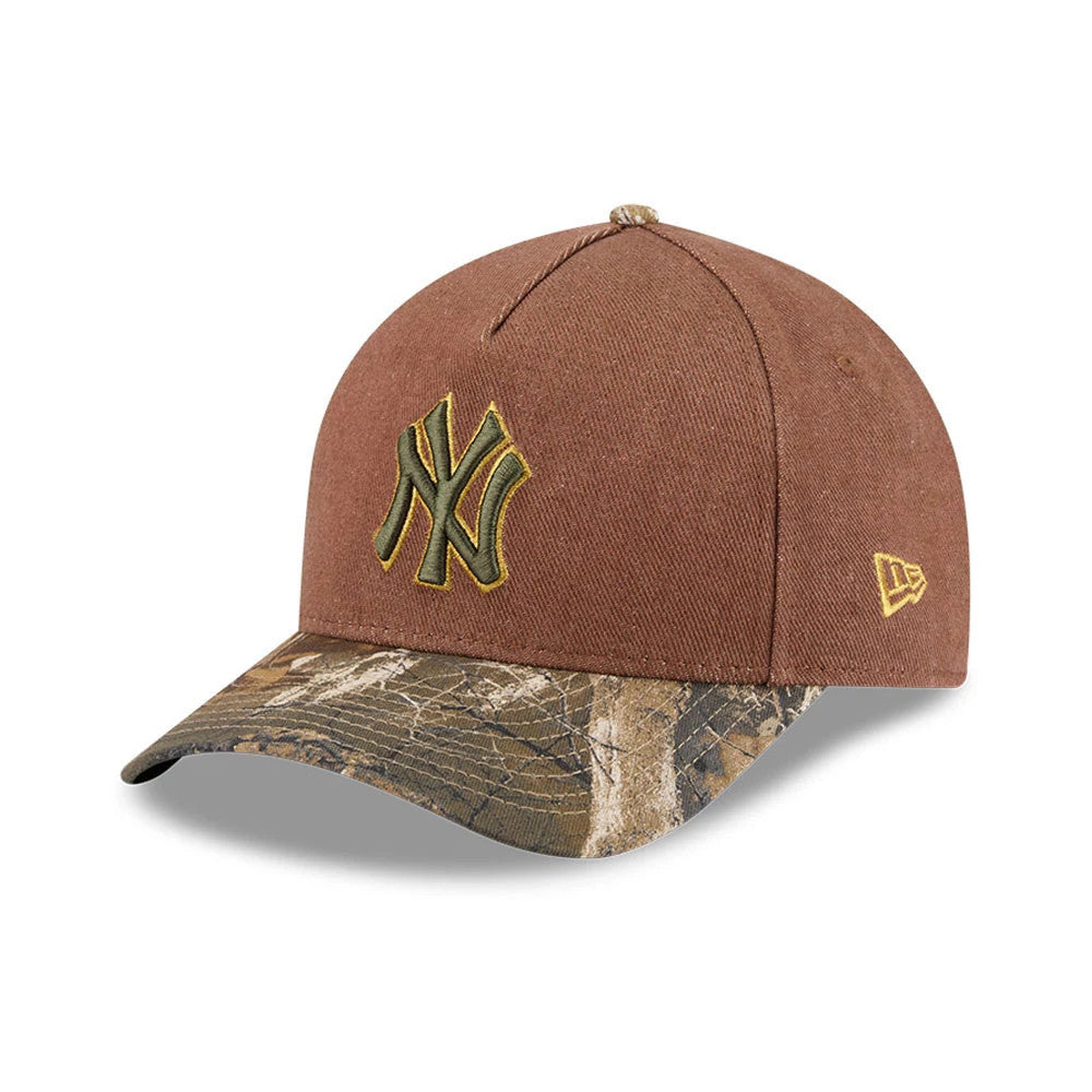 Yankees MLB Cotton Twill Dark Beige New Era 9FORTY M-Crown A-Frame Adjustable Cap, three-quarter view showing the dark beige crown with a raised embroidered yellow NY logo, camo-patterned visor, and New Era flag logo on the left side.
