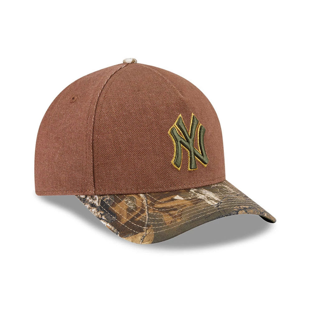 Yankees MLB Cotton Twill Dark Beige New Era 9FORTY M-Crown A-Frame Adjustable Cap, front view showing the raised olive green embroidered NY logo on the dark beige crown, and a camo-patterned curved visor with a beige top button.