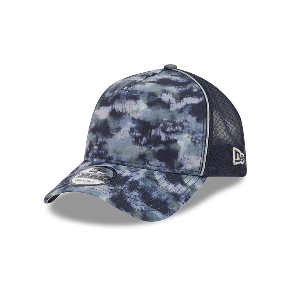 New Era Elevated Basics Navy 9FORTY A-Frame Adjustable Cap, three-quarter view showing a camouflage-like blue and navy pattern on the structured front panels, a contrasting navy mesh on the sides, and a 9FORTY size sticker on the curved visor.