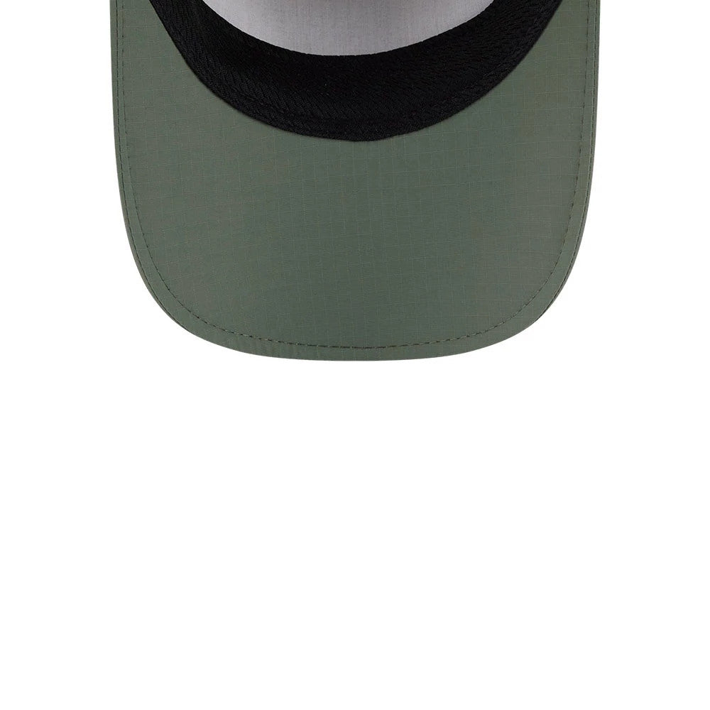 New Era Elevated Basics Open Green Runner Adjustable Cap, inside view showing the black sweatband against the green fabric of the visor with stitching lines and a contrast white internal surface.