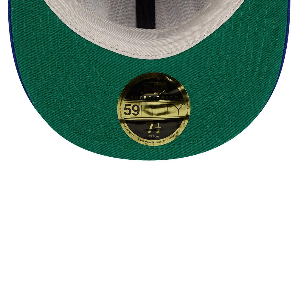 LA Dodgers Fear Of God X MLB Open Blue Retro Crown New Era 59FIFTY Fitted Cap, inside view showing a green undervisor with a gold 59FIFTY size sticker at the centre, white taping along the seams, and a grey sweatband.