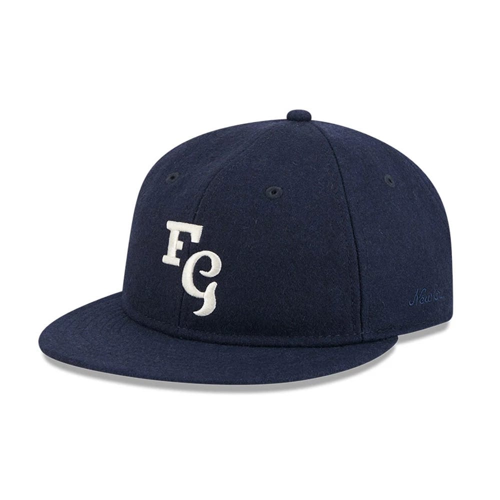 Pictured is this Fear Of God X MLB New York Yankees Retro Crown 59FIFTY Fitted cap in navy. 1