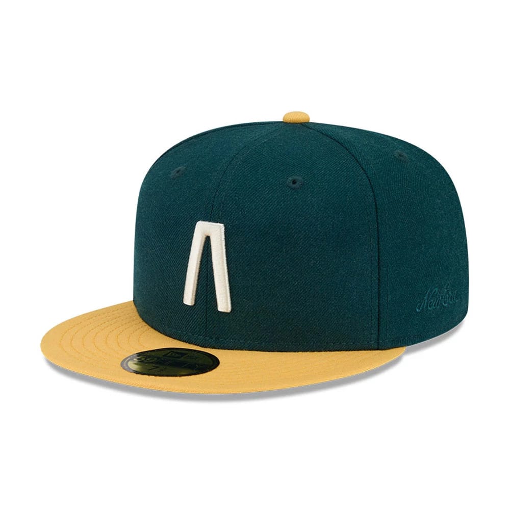 Pictured is this Fear Of God X MLB Logo 59FIFTY Fitted cap in dark green. 1