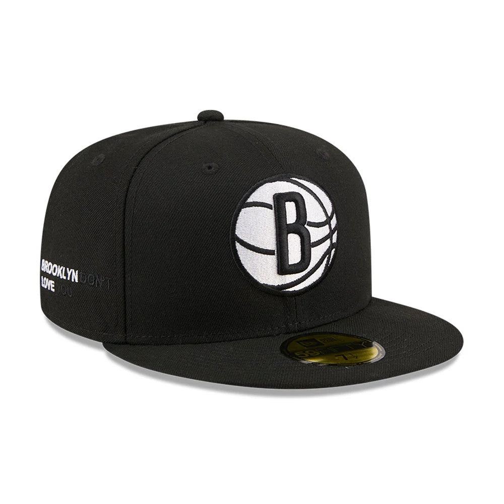 Brooklyn Nets NBA X J-FROST Black New Era 59FIFTY Fitted Cap, front view showing a raised black and white Brooklyn Nets logo on the front panel, with a gold 59FIFTY size sticker on the black flat visor and eyelets on the crown.