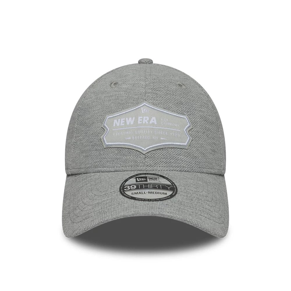 New Era Jersey Grey New Era 39THIRTY Stretch Fit Cap, front view showing a large white embroidered patch with New Era lettering on the structured grey crown, a curved grey visor, and a 39THIRTY size sticker in black and white.