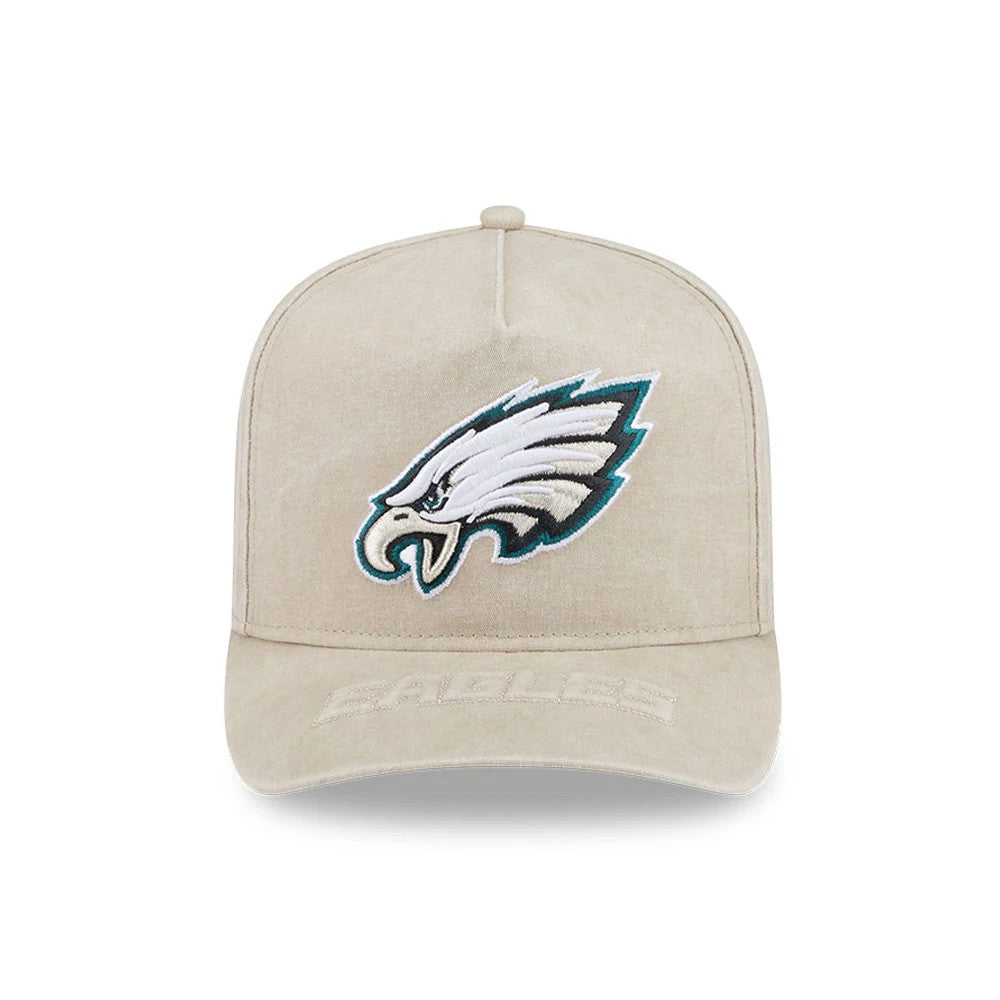 Philadelphia Eagles NFL Light Beige New Era 9FIFTY A-Frame Snapback Adjustable Cap, front view showing the embroidered Eagles logo in white, black, and teal on the light beige structured crown, with raised Eagles text on the matching flat visor.
