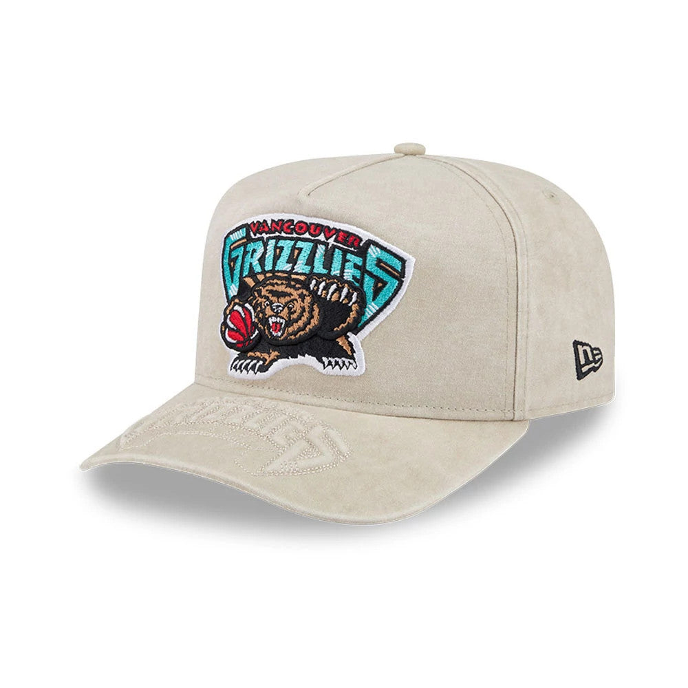 Vancouver Grizzlies NBA Light Beige New Era 9FIFTY A-Frame Snapback Adjustable Cap, three-quarter view showing the embroidered Vancouver Grizzlies logo on the structured front panel, a matching light beige visor.