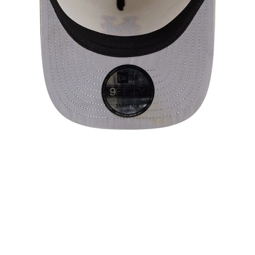 New York Mets MLB Light Beige New Era 9FIFTY A-Frame Snapback Adjustable Cap, inside view showing the black undervisor with a 9FIFTY size sticker, light beige taping along the panel seams, and a Mets logo under the crown.