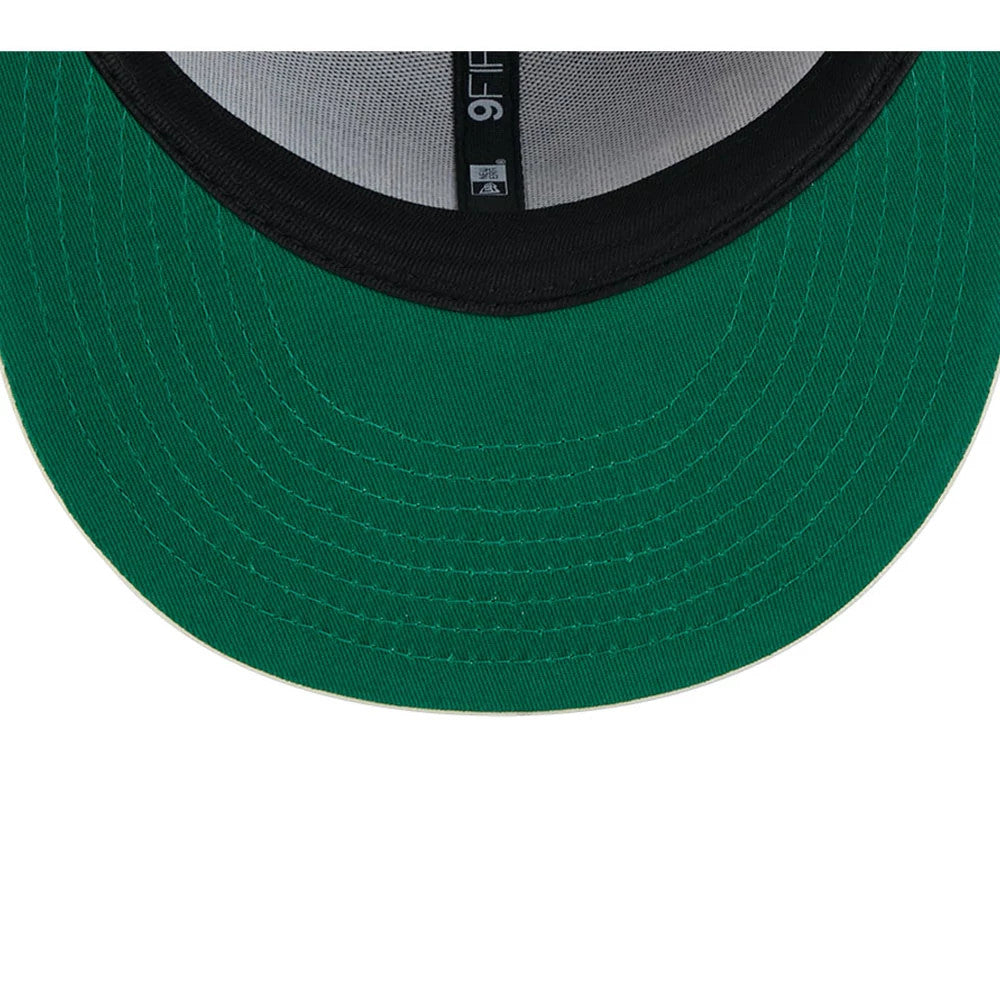 Vikings NFL Rivalry 2026 Dark Purple New Era 9FIFTY Snapback Adjustable Cap, inside view showing the green undervisor, black sweatband, and grey taping with an MLB logo at the centre, highlighting the structural details.