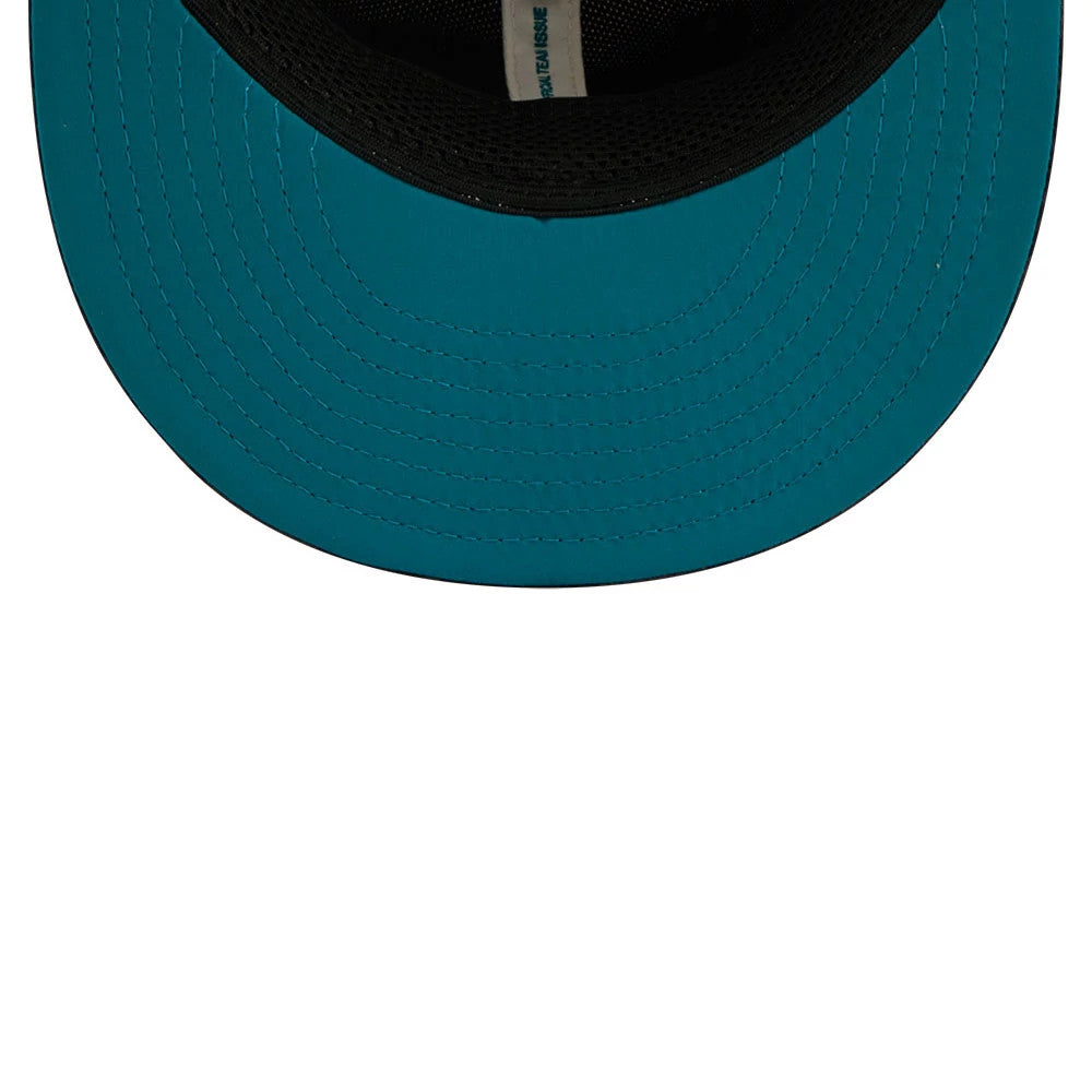 Jacksonville Jaguars NFL Rivalry 2026 White & Jaguar Print New Era 59FIFTY Fitted Cap, inside view showing the vivid teal undervisor, the black sweatband along the inner crown, and a strip of taping with text running across the centre.