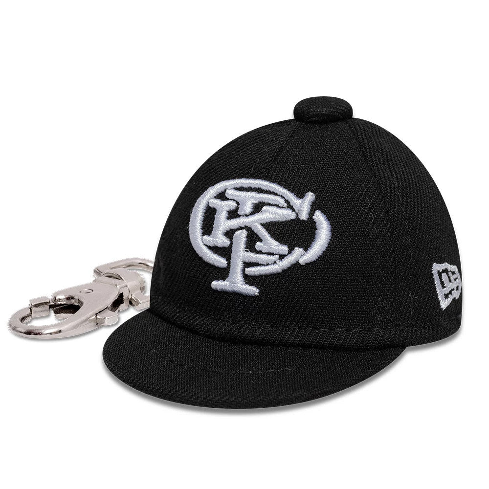 Gettomasa X New Era Black Key Chain, three-quarter view showing a miniature cap design with a white raised embroidered logo on the front panel, a matching black visor, and a silver clasp for attachment.