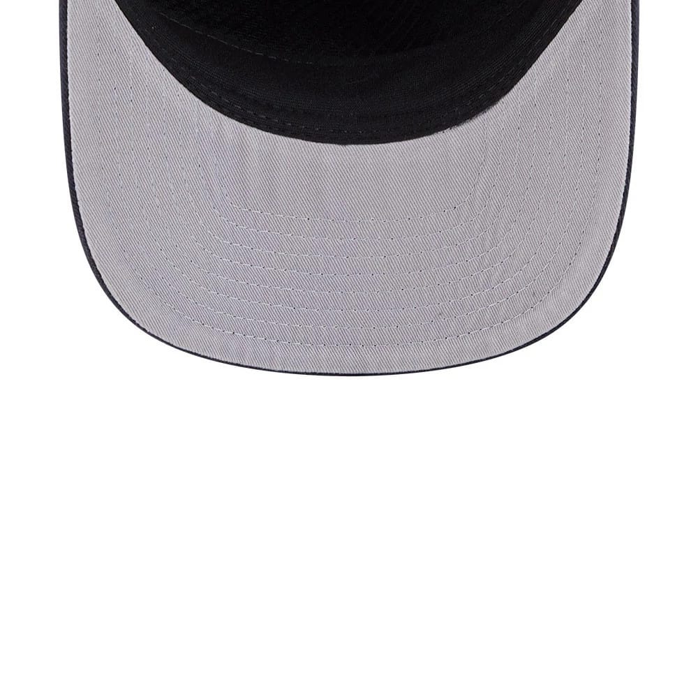 Atlanta Braves MLB Evergreen Navy New Era 19TWENTY Adjustable Cap, inside view showing the light grey undervisor with navy edging, detailed stitching lines, and the black interior crown fabric partially at the top edge.