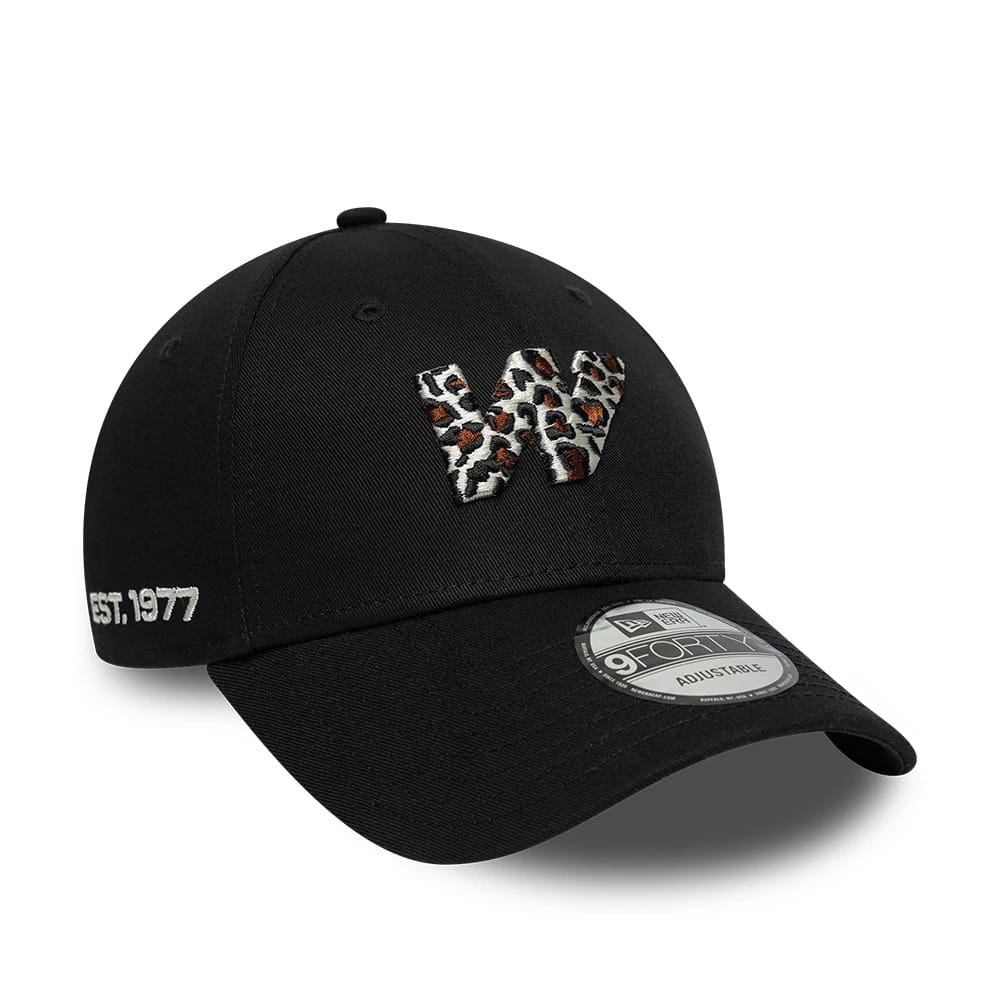 Williams Animal Infill Black New Era 9FORTY Adjustable Cap, three-quarter view showing a animal print embroidered letter W on the front panel, a black pre-curved visor with a 9FORTY size sticker, and 'Est. 1977' on the side.