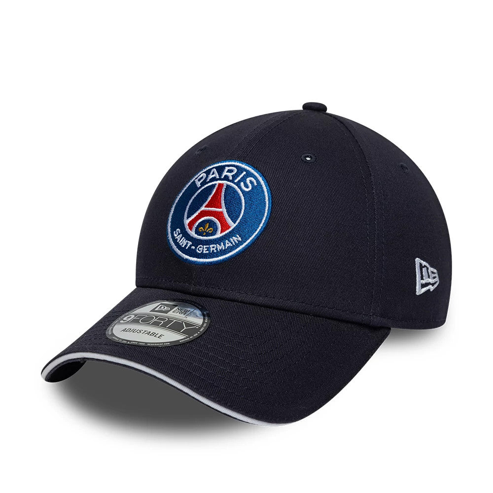 Paris Saint-Germain Core Navy New Era 9FORTY Adjustable Cap, three-quarter view showing the large embroidered Paris Saint-Germain emblem on the front panel, a curved navy visor with a 9FORTY size sticker.