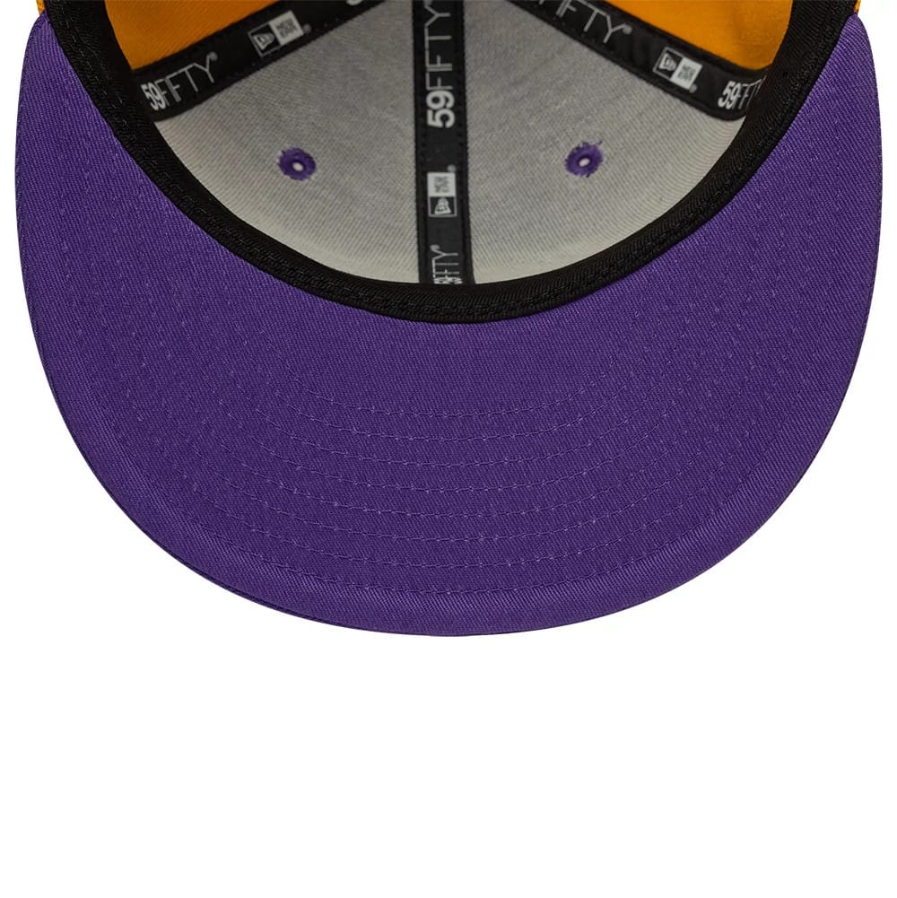 LA Lakers NBA Hardwood Classic Players Purple New Era 59FIFTY Fitted Cap, inside view showing the black taping with New Era branding, purple eyelets, an orange sweatband, and a vivid purple undervisor complementing the structured design.