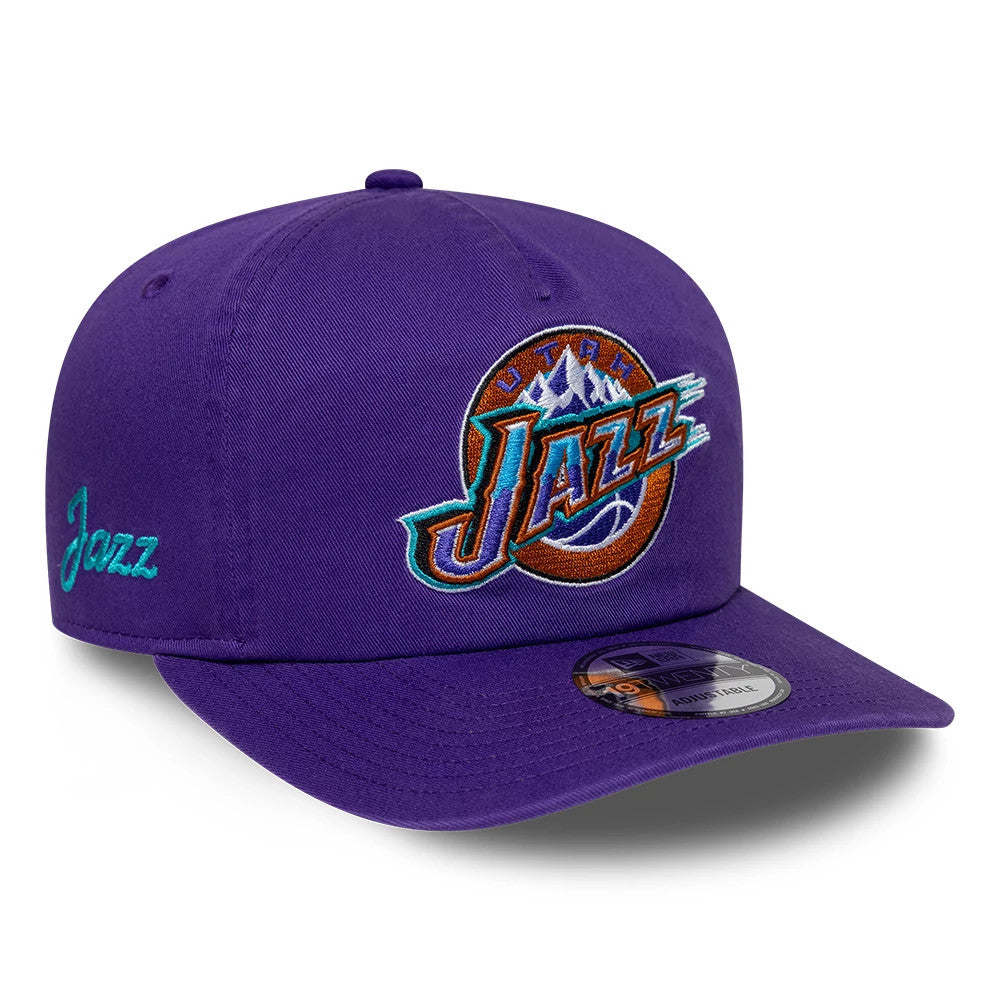 Utah Jazz NBA Hardwood Classic Purple New Era 19TWENTY Adjustable Cap, three-quarter view showing the embroidered Jazz logo on the front panel, teal script logo on the left side, and a 19TWENTY size sticker on its purple visor.