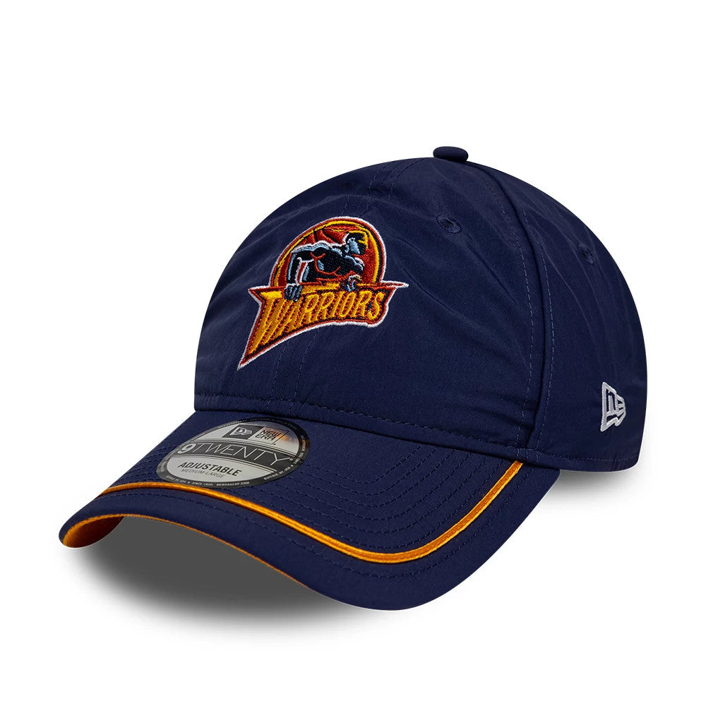 Warriors NBA Hardwood Classic Nylon Dark Blue New Era 9TWENTY Adjustable Cap, front three-quarter view showing the retro Warriors logo in raised embroidery on the front panel, yellow trim along the curved visor.