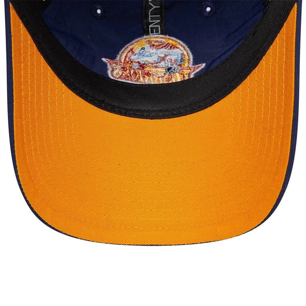 Warriors NBA Hardwood Classic Nylon Dark Blue New Era 9TWENTY Adjustable Cap, inside view showing a yellow undervisor, an embroidered team logo under the crown, black taping with 9TWENTY branding, and small embroidered eyelets.
