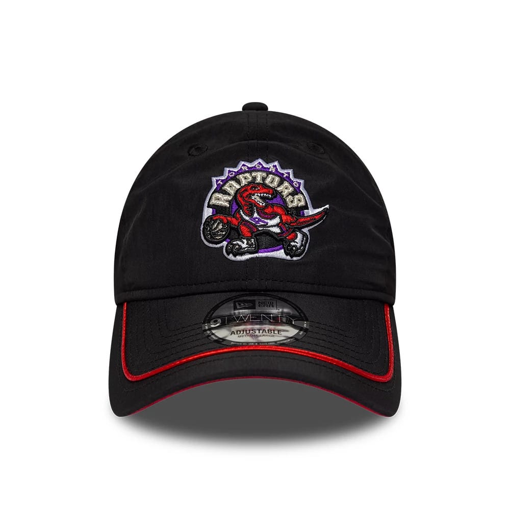 Toronto Raptors NBA Hardwood Classic Nylon Black New Era 9TWENTY Adjustable Cap, front view showing an embroidered Raptors logo on the black crown, red piping along the edge of the curved visor, and a clear 9TWENTY size sticker on the visor.