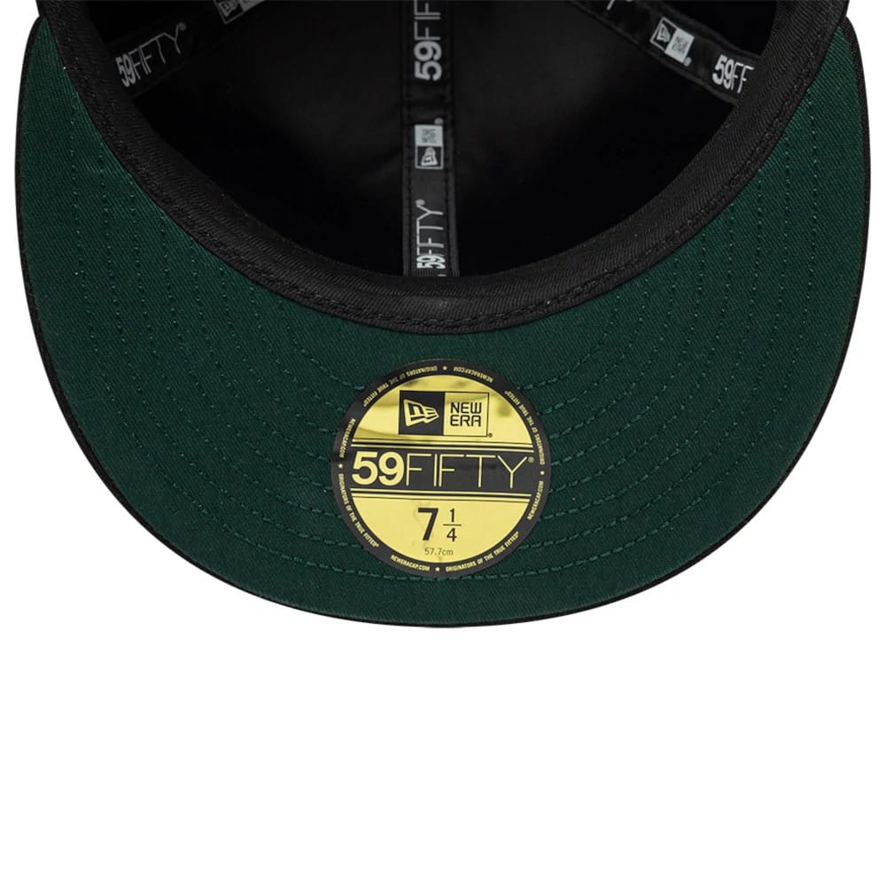 NBA All Over Hardwood Classic All Over Black New Era 59FIFTY Fitted Cap, inside view showing the black and green undervisor with a gold 59FIFTY size sticker, black interior taping featuring repeating 59FIFTY and New Era logos.