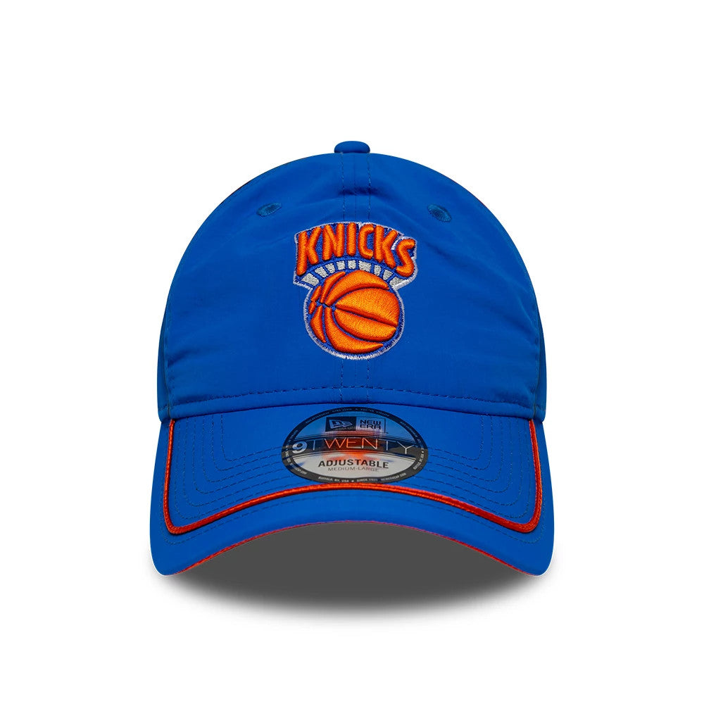 New York Knicks NBA Hardwood Classic Nylon Blue New Era 9TWENTY Adjustable Cap, front view showing the raised orange and white embroidered Knicks logo on the unstructured blue crown, with a 9TWENTY size sticker on the slightly curved visor.