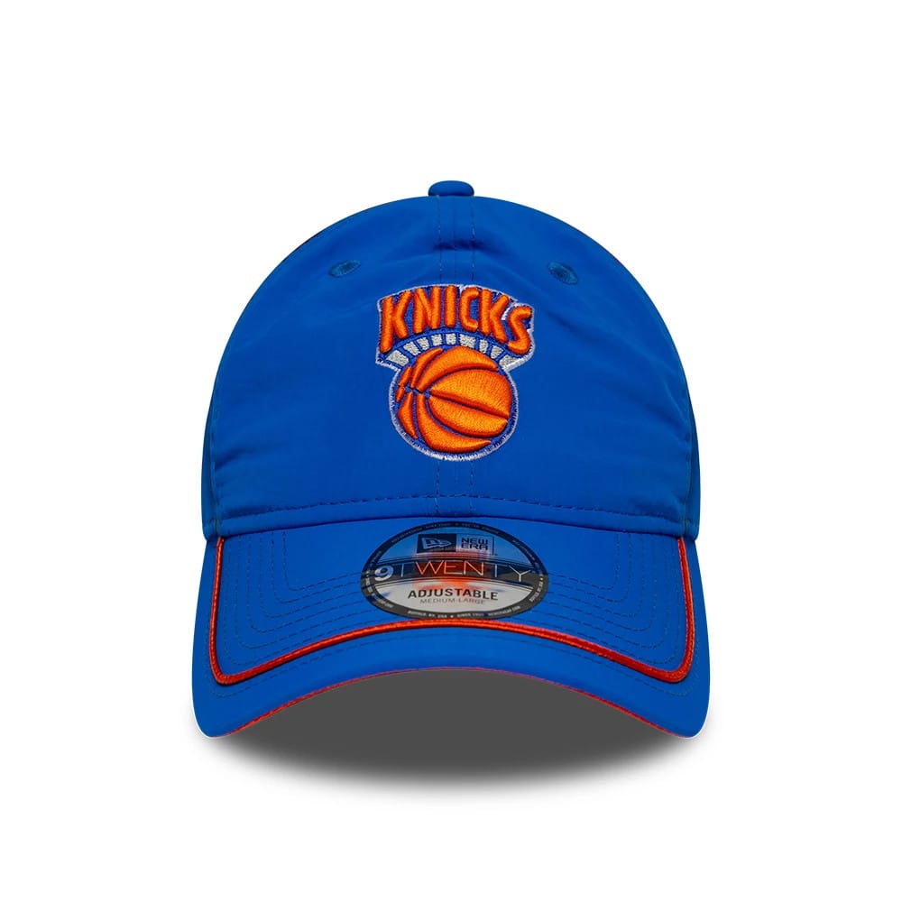 New York Knicks NBA Hardwood Classic Nylon Blue New Era 9TWENTY Adjustable Cap, front view showing the raised orange and white embroidered Knicks logo on the unstructured blue crown, with a 9TWENTY size sticker on the slightly curved visor.