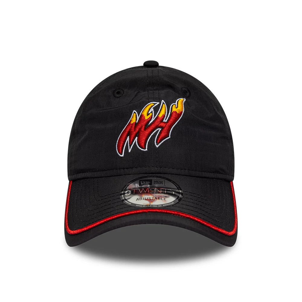 Miami Heat NBA Hardwood Classic Nylon Black New Era 9TWENTY Adjustable Cap, front view showing a red and yellow embroidered Miami Heat logo on the black unstructured crown, a curved visor with red edging, and a 9TWENTY size sticker.