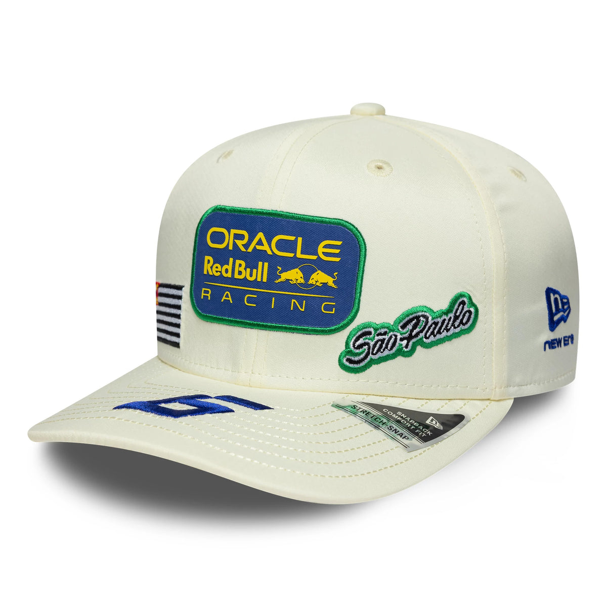 Red Bull Racing Brazil Race Special Isack Hadjar Cream New Era 9SEVENTY Stretch Snap Adjustable Cap, three-quarter view showing a blue and yellow embroidered Oracle Red Bull Racing logo on the front panel, cream curved visor.
