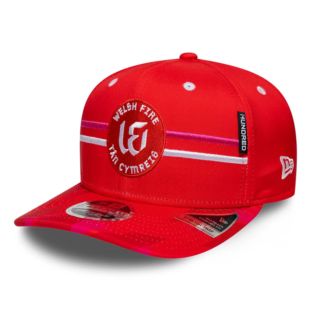 Welsh Fire Tan Cymreig The Hundred 2026 Red New Era 9SEVENTY Stretch Snap Adjustable Cap, front view showing a white and pink embroidered logo on the front panel, a matching red curved visor with a 9SEVENTY size sticker.