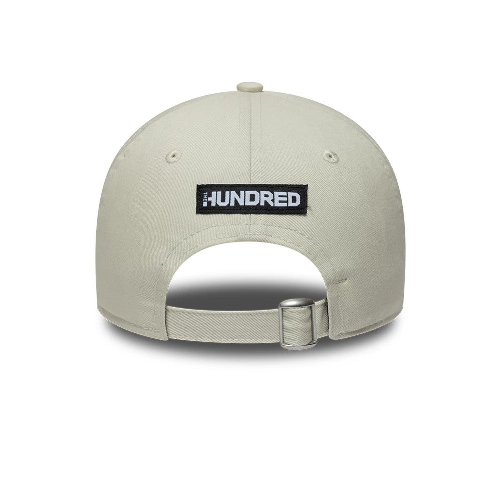 MI London The Hundred 2026 Light Beige & Blue New Era 9TWENTY Adjustable Cap, rear view showing the black and white embroidered The Hundred patch centrally placed above the fabric strap with a silver buckle on the light beige crown.