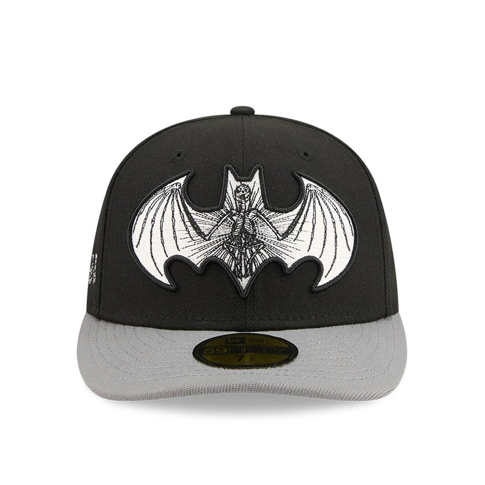 DC Batman Black New Era 59FIFTY Fitted Cap, front view showing a prominent black and white embroidered Batman graphic on the front panel, complemented by a grey flat visor and a gold 59FIFTY size sticker on the top of the visor.