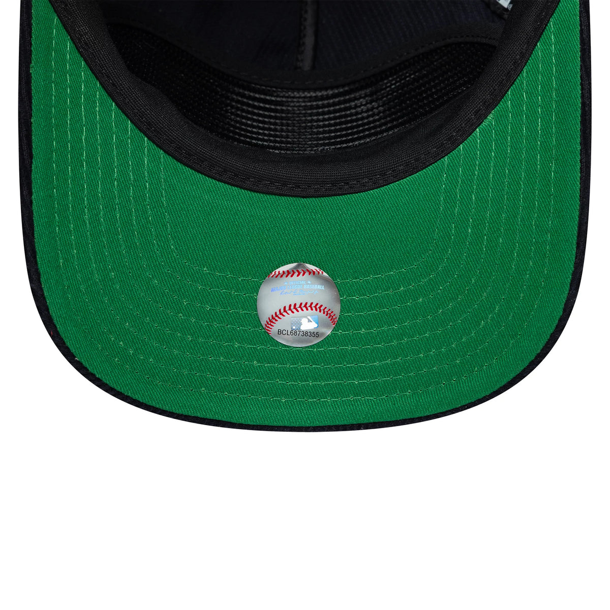 New York Yankees MLB Retro Dynasty Cord Navy New Era 19TWENTY Adjustable Cap, inside view showing a vivid green undervisor with detailed stitching, a reflective sticker featuring a baseball graphic, and a black sweatband.