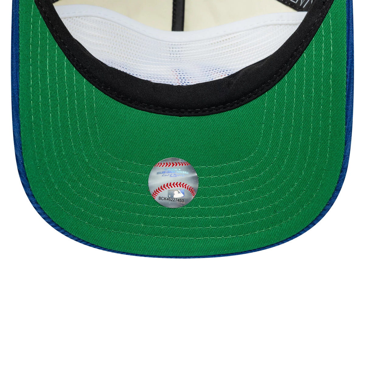 New York Mets MLB Retro Dynasty Cord Cream & Blue New Era 19TWENTY Adjustable Cap, inside view showing the green undervisor with a baseball-themed sticker, black sweatband, and white mesh lining under the structured crown.