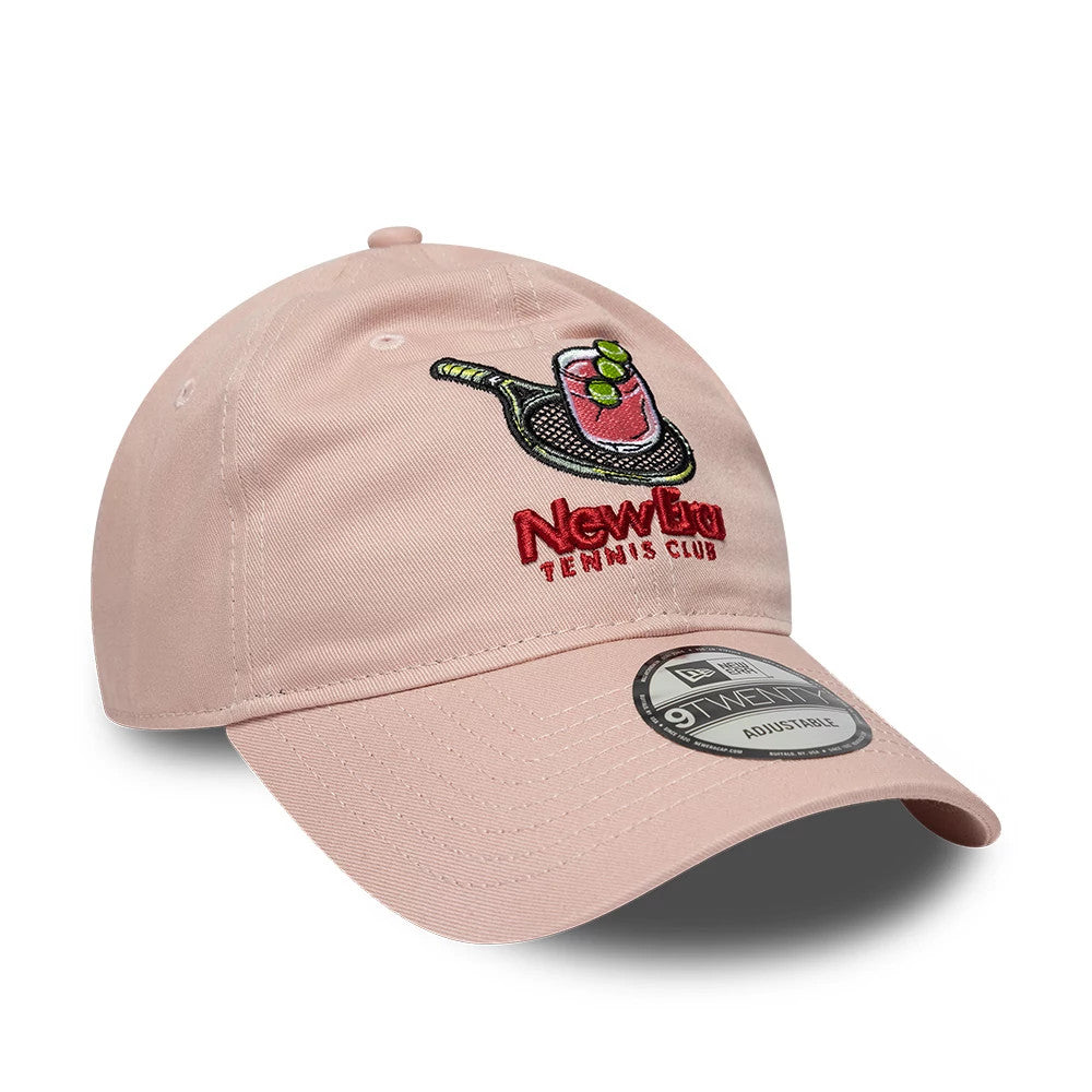 New Era Tennis Club Pastel Pink New Era 9TWENTY Adjustable Cap, three-quarter view showing the colourful embroidered tennis racket and drink graphic on the front panel, curved visor with 9TWENTY size sticker.
