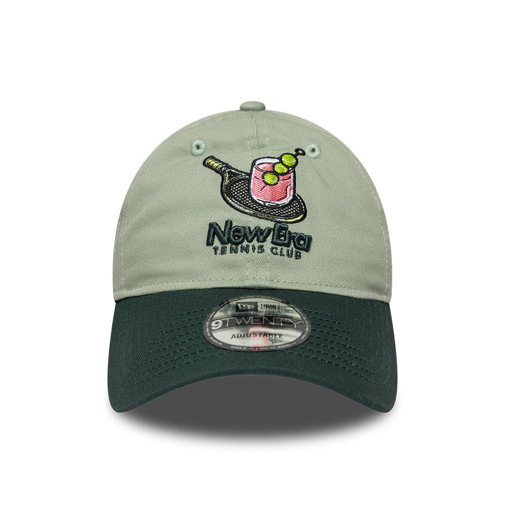 New Era Tennis Club Pastel Green 9TWENTY Adjustable Cap, front view showing an embroidered graphic with a tennis racket, cocktail and tennis balls on the centre of the pastel green crown, paired with a dark green curved visor.