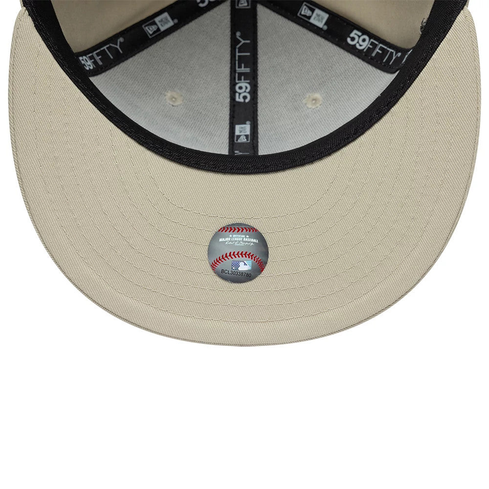 Chicago White Sox MLB Floral Light Beige New Era 59FIFTY Fitted Cap, inside view showing the black sweatband with repeated 59FIFTY branding, light beige undervisor, and a baseball-themed sticker centred on the undervisor.