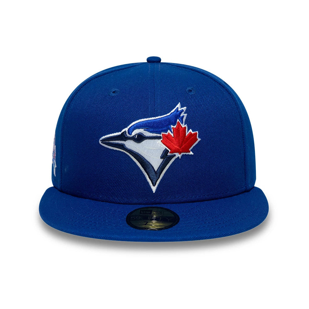 Toronto Blue Jays MLB Cooperstown Blue New Era 59FIFTY Fitted Cap, front view showing the embroidered blue jay and red maple leaf logo on the front panel, blue flat visor, and black 59FIFTY size sticker on the visor.