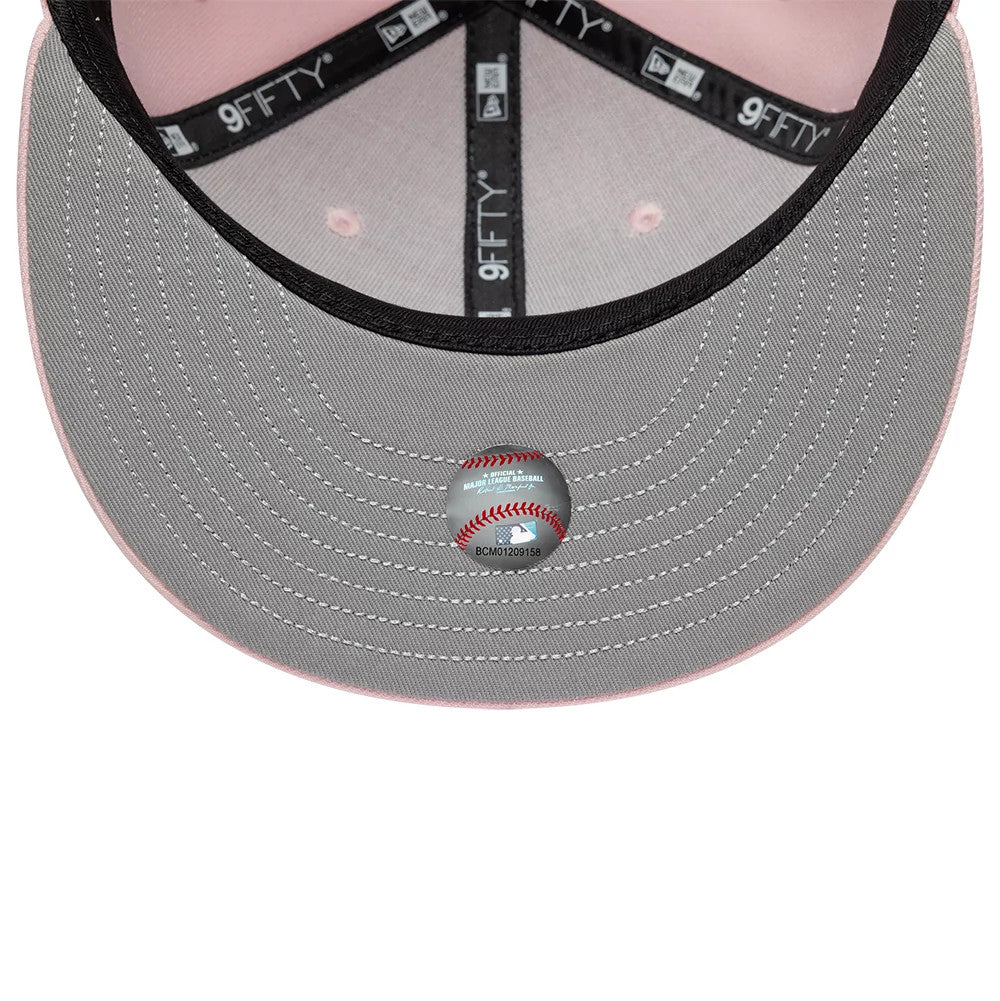 New York Yankees MLB Floral Pastel Pink New Era 9FIFTY Snapback Adjustable Cap, inside view showing the grey undervisor with intricate stitching, a baseball-themed sticker at the centre, and black taping with 9FIFTY branding.