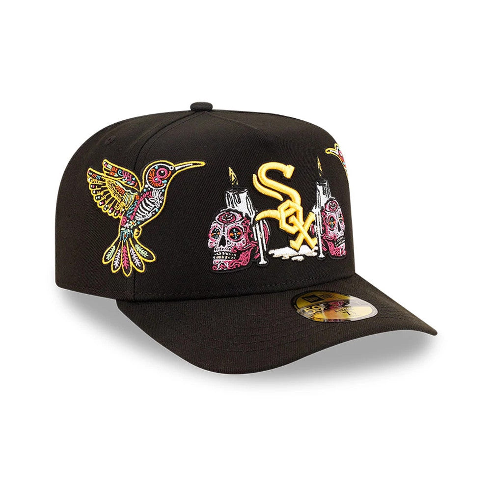 Chicago White Sox MLB Day Of The Dead Black New Era 59FIFTY A-Frame Fitted Cap, three-quarter view showing yellow and white embroidered team logo on the front panel, multicoloured hummingbird and skull designs beside it.