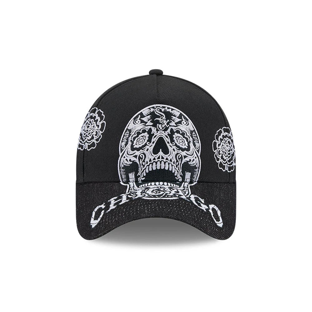 Chicago White Sox MLB Day Of The Dead Black New Era 9FORTY A-Frame Adjustable Cap, front view showing a large white sugar skull embroidery on the structured black crown, flanked by floral designs, with Chicago text on the black curved visor.