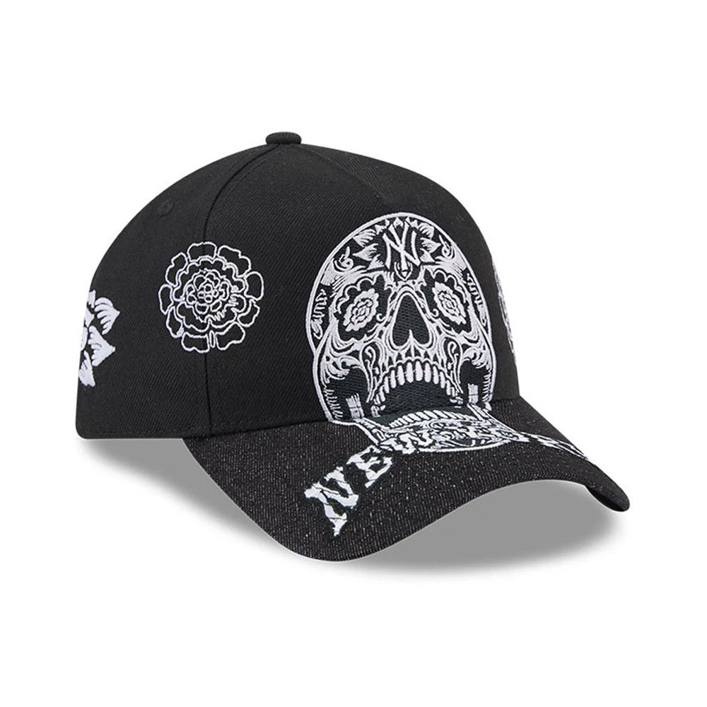 New York Yankees MLB Day Of The Dead Black New Era 9FORTY A-Frame Adjustable Cap, three-quarter view showing the intricate white embroidered skull design on the front panel, paired with floral motifs and NEW YORK text on the black curved visor.