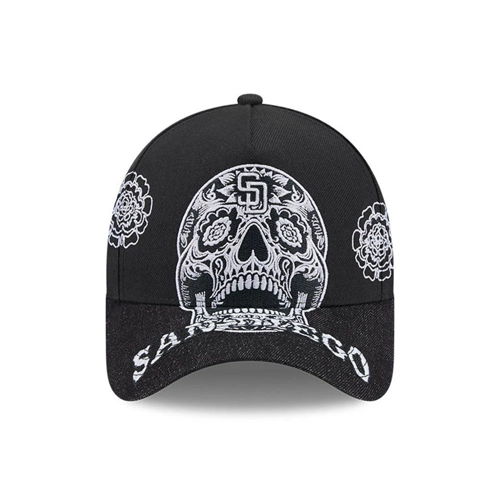 San Diego Padres MLB Day Of The Dead Black New Era 9FORTY A-Frame Adjustable Cap, front view showing a white embroidered sugar skull design on the structured black crown, San Diego text on the curved visor, with floral details on the side panels.