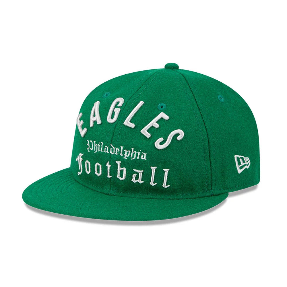 Eagles NFL Historic Arch Green Retro Crown New Era 59FIFTY Fitted Cap, three-quarter view showing raised white Eagles lettering and Philadelphia Football script on the front panels, with a green flat visor and the New Era flag logo on the left side.