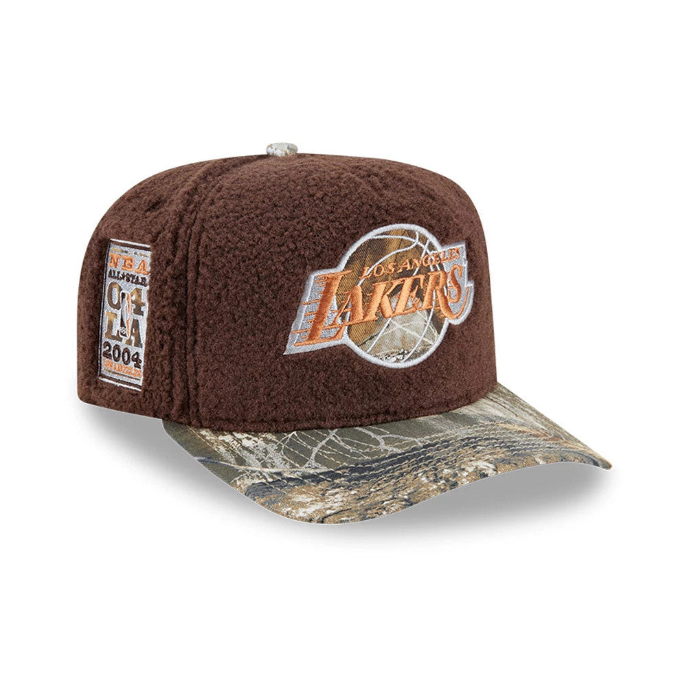 LA Lakers NBA Hardwood Classic Brown New Era 59FIFTY A-Frame Fitted Cap, three-quarter view showing the orange raised embroidered Lakers logo on the front panel, with a camouflage flat visor and an NBA All-Star 2004 patch on the left side.